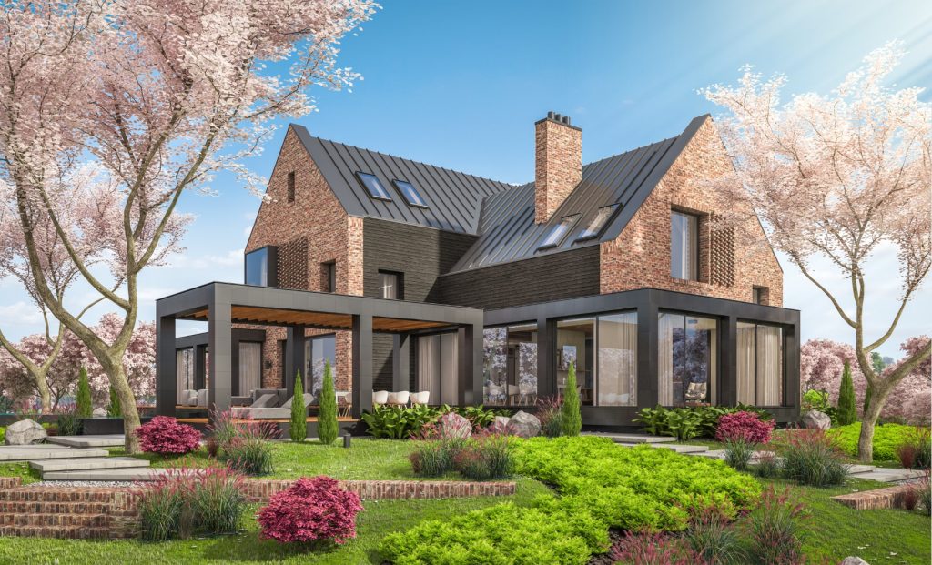 Modernes, gemütliches Klinkerhaus mit modernem Steildach an den Teichen mit Garage und Pool zum Verkauf oder zur Miete. Frischer Frühlingstag mit blühenden Bäumen mit Sakura-Blumen im Hintergrund.